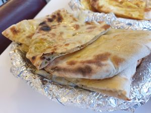 Masala kulcha $5.00: fluffy naan, tasty filling at Krishna Pait Pooja in Footscray