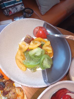 Salad tomato with cheese at Kitty Hawk Rooftop Bar and Restaurant in London