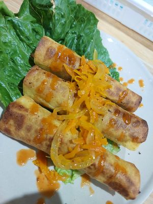 Soy curls with potatoes and onion wrap in corn tortillas and top with carrot and onion. This is gluten free. at Homey Food & Cafe in Calgary