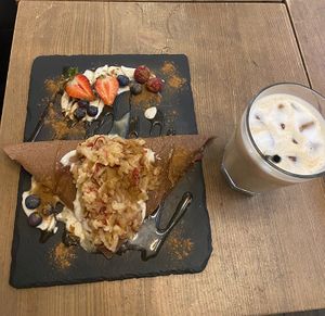 Apple Crêpe with oat milk iced latte   at MyRaw Cafe in Prague