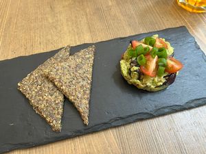 Avocado tartare split into two portions  at MyRaw Cafe in Prague