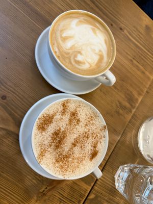 Chai latte with soy mylk and a cappuccino with soy mylk at MyRaw Cafe in Prague