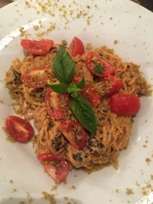 Italian kelp noodles - pesto rosso, basil, tomatoes and olives. So good! at MyRaw Cafe in Prague