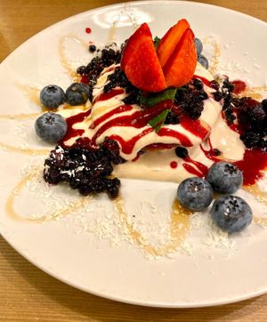 Pancakes with cashew cream and blueberries at MyRaw Cafe in Prague
