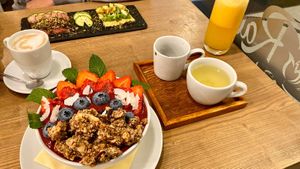 Awesome breakfast with coffee, green tea und fresh orange juice. at MyRaw Cafe in Prague