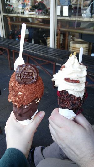Caramel ice cream coated in toasted coconut in a chocolate almond cone (left). Chamomile feijoa ice cream in a coco nib and plum cone with pecans. at Giapo in Auckland