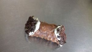 vegan cannolo filled with soy ricotta cheese at Alchemilla in Bologna