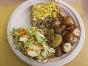 Millet with chicory and tempeh with potatoes at Alchemilla in Bologna