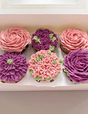 Vegan floral cupcakes featuring roses, hydrangeas, and more. at Plant Pastry in Jacksonville