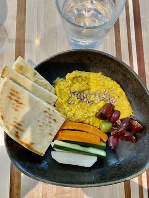 Carrot hummus, a little runny. Beautiful presentation   at DEN - Root Down - TC in Denver