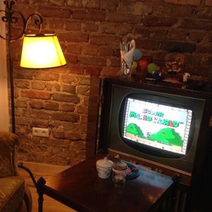 Gaming corner with an old TV set and a Super Nintendo.  at Kruemelkueche in Duisburg