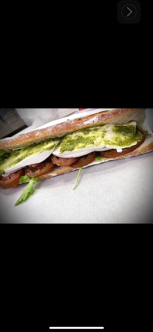 Veganzola , tomato, basil, pesto!   at Vromage Dairy-Free Cheese Shop in West Hollywood