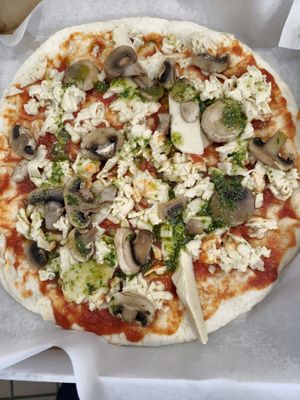 
Mozzarella pesto mushrooms pizza. Cooked at home  at Vromage Dairy-Free Cheese Shop in West Hollywood