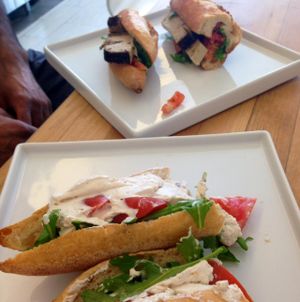 foreground: Brie with Truffle; background: Peppery Asiago  at Vromage Dairy-Free Cheese Shop in West Hollywood