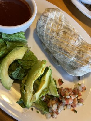  Veggie burrito with avocado and red chili sauce on the side    at Notchtop Bakery and Cafe in Estes Park