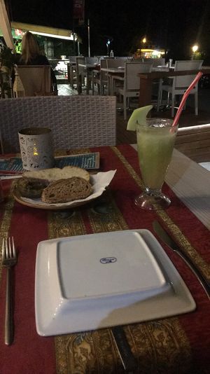 Fresh melon juice and bread with aubergine dip  at Gran Aladino in Corfu
