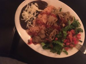 Burrito with seitan on the plate  at Taqueria in Tel Aviv