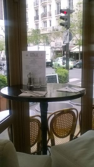 une petite table de deux, intime et typiquement parisienne at Brasserie LoLa in Paris