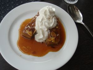 Delectable dessert with coconut whipped cream. at Brasserie LoLa in Paris
