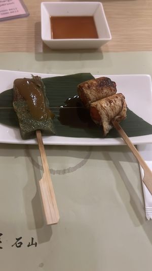 Tomato wrapped in tofu skin + some green mochi sort of thing  at Isoya Japanese Vegetarian in Hong Kong Island