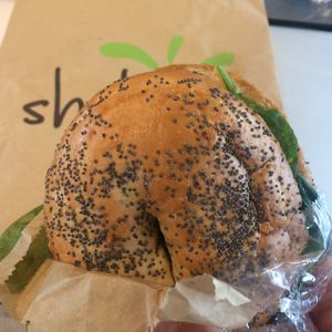 Bagel with hummus, spinach, walnuts, and sun dried tomatoes. Nice snack.  at Shake Cafe - Santa Maria Novella in Florence