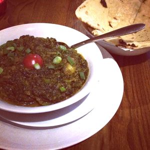 Curry with fresh naan at Karmana 100% Plant Based in Northampton