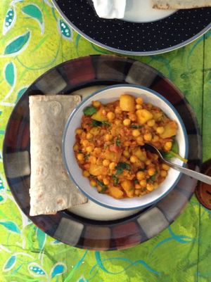Spinach and chickpea curry with a gluten free vegan wrap.  at Mudlarks Garden Cafe in Hertford