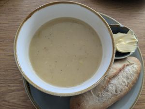 Leek and potato soup with coconut. Baguette with vegan spread. at Mudlarks Garden Cafe in Hertford