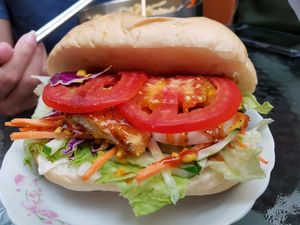Teriyaki Burger (soy) with lots of salad vege and the best softest white bun you've ever eaten! at Joy Bar in Taipei