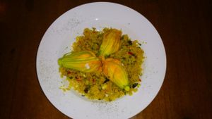 Vegetable Cous Cous with zucchini flowers stuffed with vegan cheese. at Fargo in Sevilla