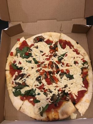 Vegan cheese with spinach and mushrooms and red peppers at Fong's Pizza in Des Moines