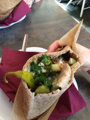 'Half and half' pita, half houmous, and half falafel, with a generous portion of fresh and pickled salads. at Humpit in Leeds