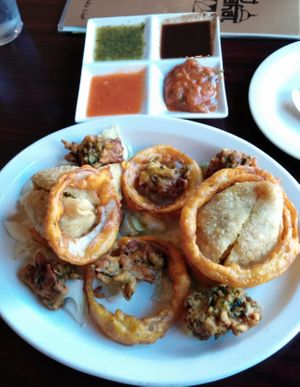 Chickpea battered veggies with side sauces. at Taj Mahal in Prescott