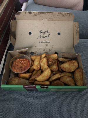 Wedges with sun-dried tomato dip  at Pizza Di Rocco in Abu Dhabi