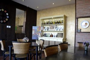 little cupboard filled with cook books and Italian spices and oils at Pizza Di Rocco in Abu Dhabi