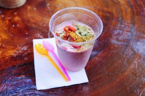 delicious coconut yoghurt parfait topped with strawberries pumpkin seeds bee pollen and bananas on the bottom at Raw Love - Ahau Tulum Beach in Tulum