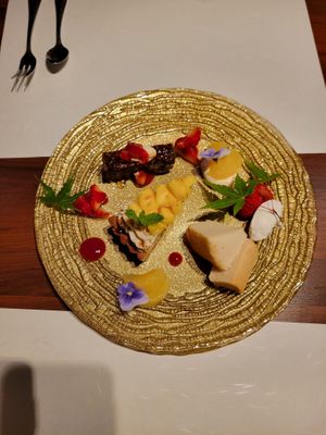 Dessert plate. Incredible sponge cake with soy whipped cream, pinapple tart, and chocolate brownie/cake thing. All fantastic.  at Little-Heaven in Kyoto