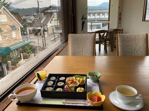 Actual serving at Ermine’s Kitchen, with a window-side table and views over Saga-Arashiyama.
 at Ermine's Kitchen in Kyoto