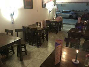 Seating. In total for 24 people (six tables that fit four people on each) at El Punto Veggie in Salento