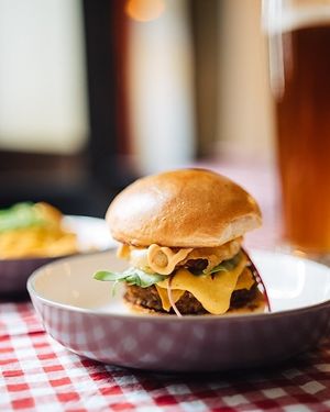 The unusual cheese burger with homemade chipotle mayo, onion rings, cashew cheese.... at MARIA in Berlin