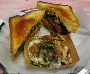 Fried Green Tomato Sandwich & Tater Salad. 2021 at Dharma Southern Chick'n in Orlando