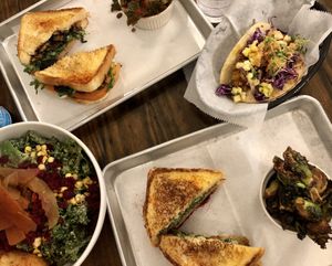 Don’t forget the sides of Brussel sprouts!   They have so many good sides.  Also shown is the kale salad, TLT, a taco special, and of course the fried green tomato sandwich  at Dharma Southern Chick'n in Orlando
