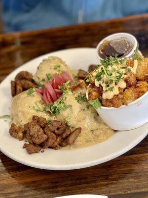 Biscuits and gravy with bbq cauli as the side - the cauliflower is the best I’ve ever had!!  at Dharma Southern Chick'n in Orlando