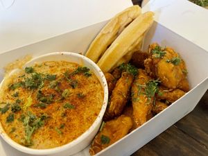 Chicken and waffles with grits   at Dharma Southern Chick'n in Orlando