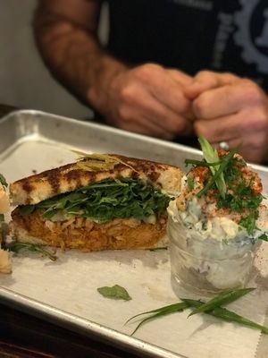 Pulled Jackfruit Sandwich with potato salad - amazing! at Dharma Southern Chick'n in Orlando