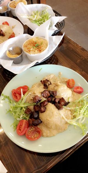Biscuits and gravy with a side of grits 😋 at Dharma Southern Chick'n in Orlando