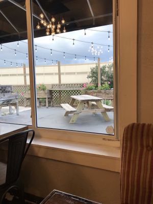 Inside looking out at the garden ✨ at Dharma Southern Chick'n in Orlando