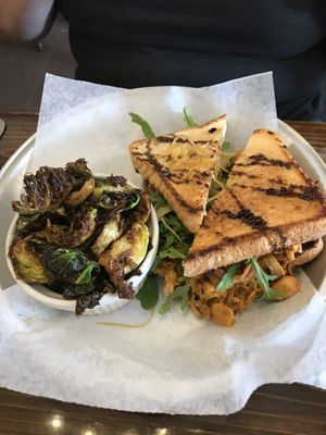 Fried green tomatoes sandwich with roasted brussels  at Dharma Southern Chick'n in Orlando