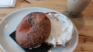 Everything bagel with vegan cream cheese and Chai tea with boba at Green Cup Cafe in Fort Myers