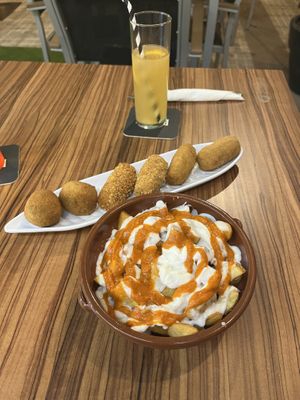 Croquetas mixed plate with all three flavours (pak Choi &Curry; red peppers; shiitake) & Patatas Bravas with vegan mayo and bravas sauce   at kVegan in Tenerife